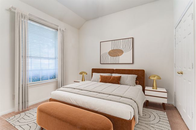 Bedroom with light carpet, multiple windows, baseboards, and vaulted ceiling | Image 26