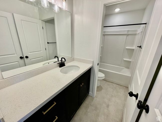 Full bathroom featuring vanity and shower / tub combination | Image 17