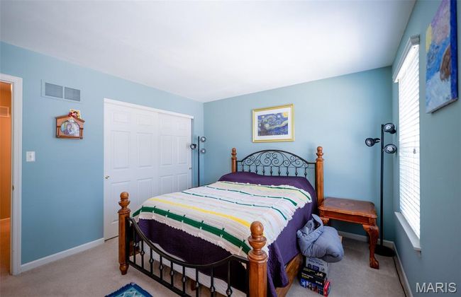 Carpeted bedroom with baseboards | Image 38