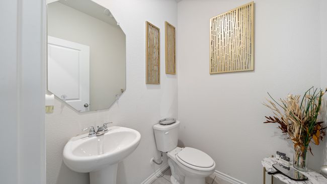 Half bathroom featuring a sink and toilet | Image 25