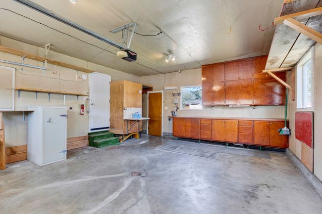 Garage with a garage door opener | Image 36