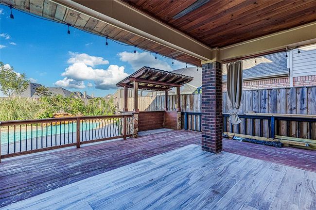 Beat the heat this summer while relaxing under the covered patio. | Image 36