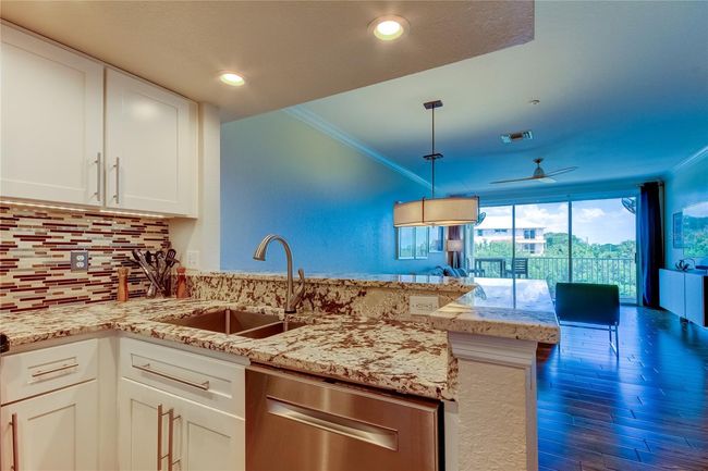 Kitchen with Stone Countertops, Stainless Steel Applicances | Image 19