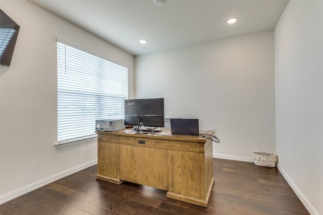 Home office with healthy amount of natural light, dark wood-style floors, and recessed lighting | Image 12