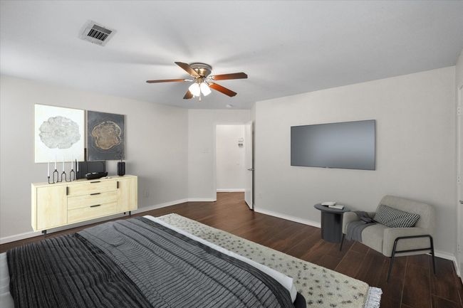 Bedroom featuring dark wood-style flooring and a ceiling fan | Image 12