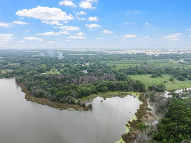 Aerial view featuring a water view and a forest view | Image 5