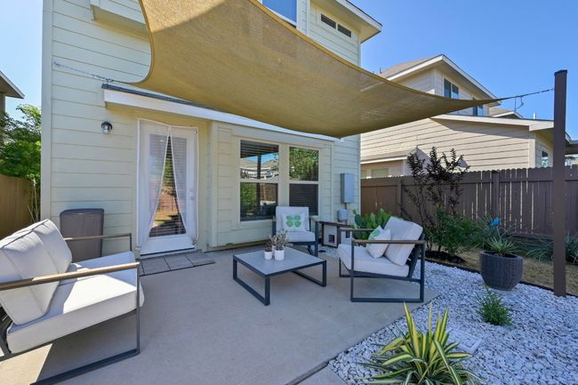 View of patio / terrace with fence and an outdoor living space | Image 4
