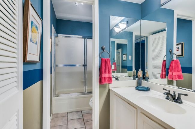 The second bathroom is well appointed for guests and offers a shower/tub combo. | Image 10
