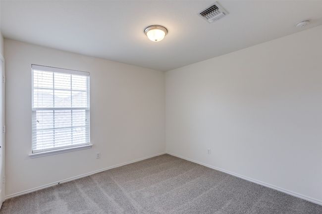 Carpeted empty room featuring baseboards, visible vents, and a wealth of natural light | Image 19