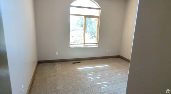 Carpeted spare room with baseboards | Image 27