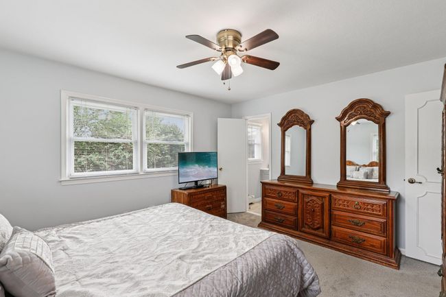 Bedroom featuring carpet and a ceiling fan | Image 12