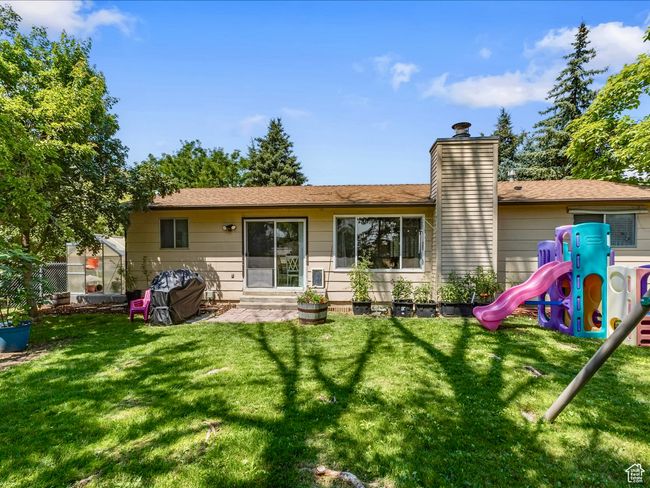 Back of property with a playground | Image 13
