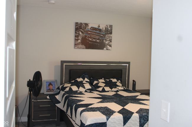 bedroom with baseboards | Image 6