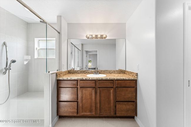 Suite #1 Walk in shower and vanity with lots of storage space | Image 73