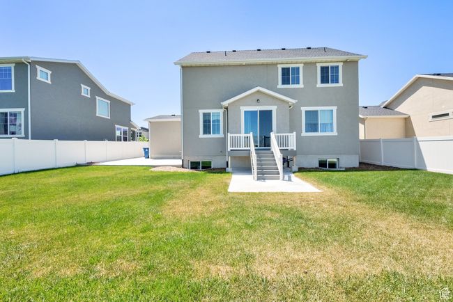 Back of house with a fenced backyard, a patio area, and stucco siding | Image 36
