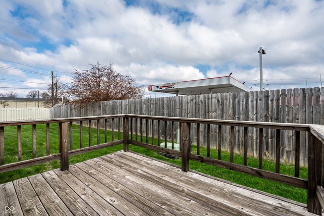 wooden deck featuring a yard and a partially fenced backyard | Image 22