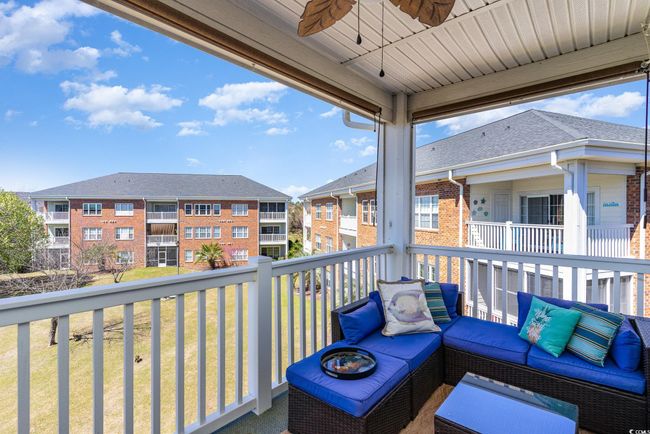 Balcony featuring an outdoor hangout area and a ceiling fan | Image 20