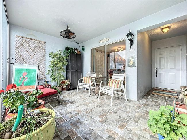 Front lanai tile floor, and yes there is a back lanai too. | Image 11