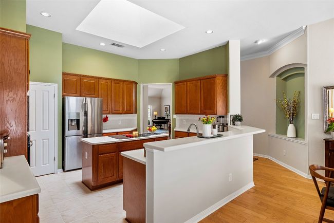 The kitchen blends style and substance with premium KitchenAid appliances, offering the perfect setup for anyone who loves to cook and entertain | Image 12