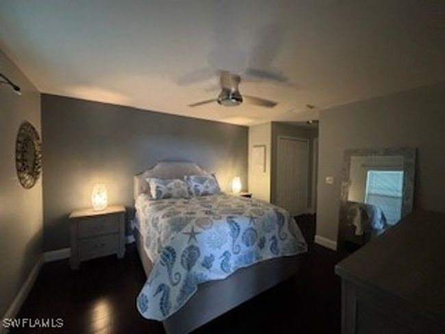 Bedroom featuring baseboards, wood finished floors, and a ceiling fan | Image 14