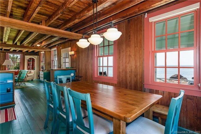 Spacious dining area off the living room with water views. | Image 9