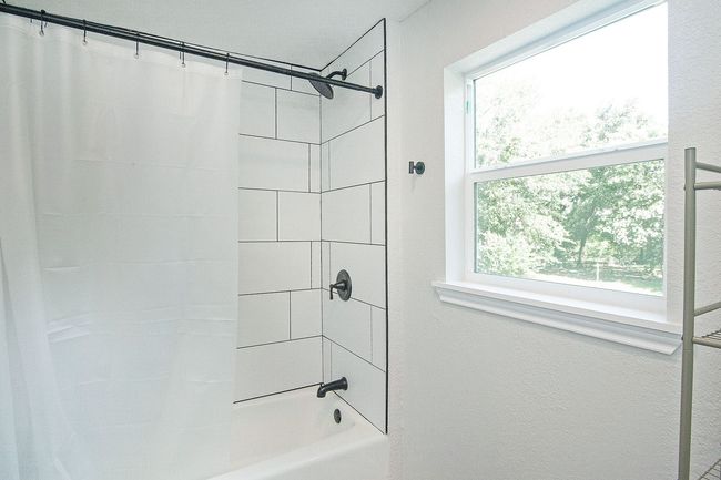 2nd story Bathroom featuring shower / bath combination with curtain | Image 24