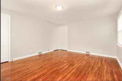 Unfurnished room featuring hardwood / wood-style floors | Image 2