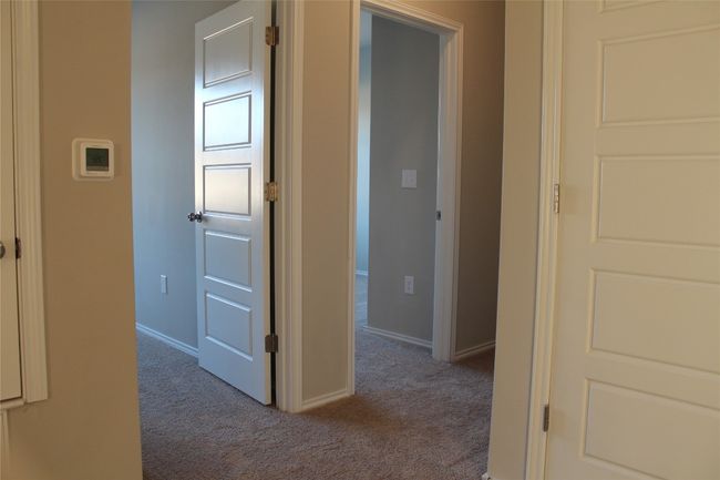 Corridor featuring carpet flooring and baseboards | Image 20