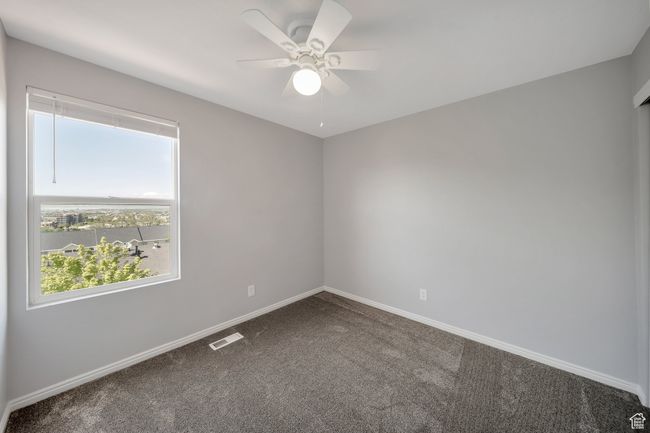 Bedroom with ceiling fan and views | Image 11