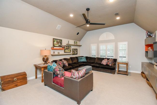 At the top of the stairs, you will find this wonderful entertainment and game room. | Image 32