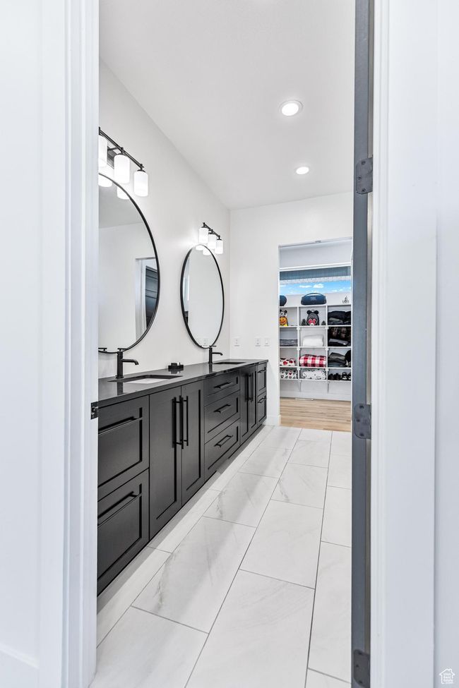 Full bath with recessed lighting, double vanity, marble finish floor, and a sink | Image 22