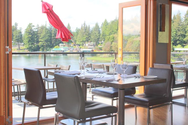 Dining room featuring a water view and wood finished floors | Image 36
