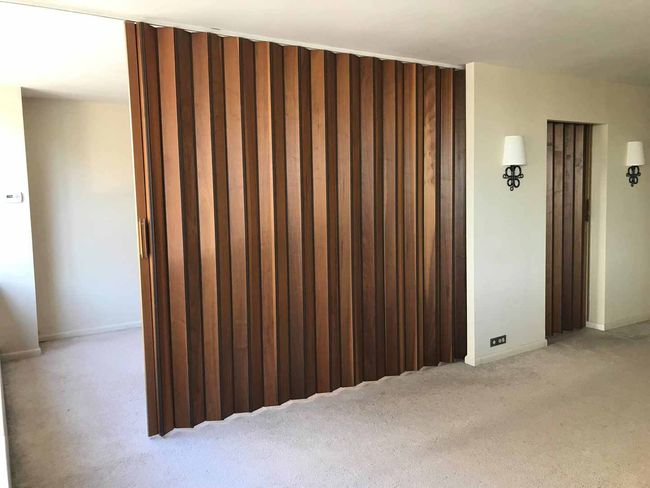Divider between bedroom & living room half closed. | Image 11