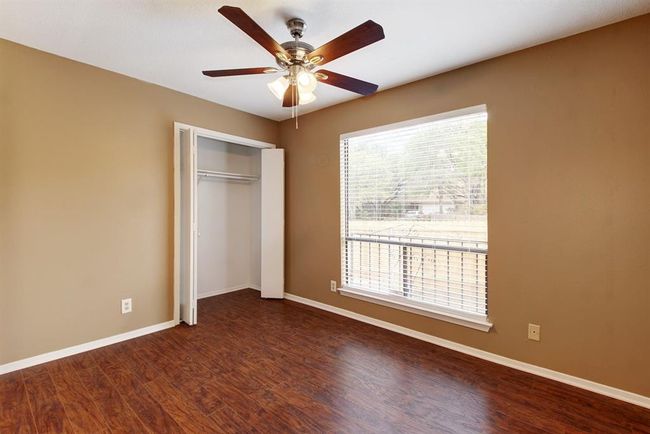 The secondary bedroom also has wood floors | Image 23