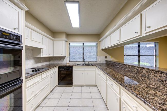 Well-appointed kitchen with plenty of storage and counter space! | Image 11