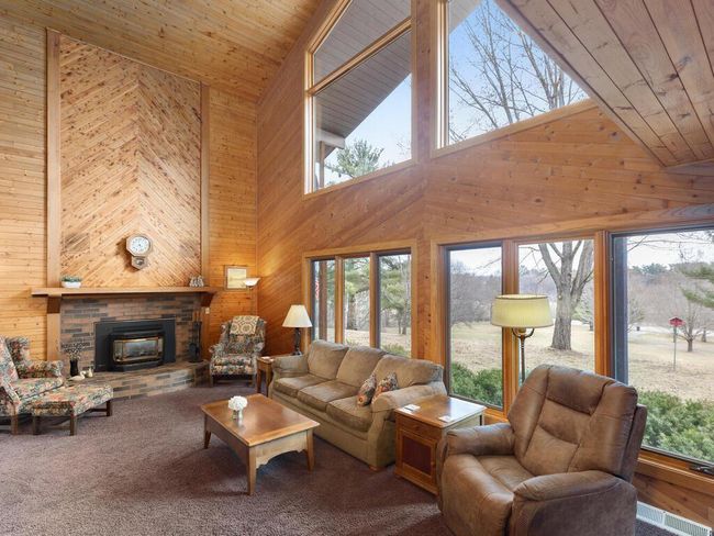 Enjoy tons of natural light and stunning views no matter the season. | Image 8