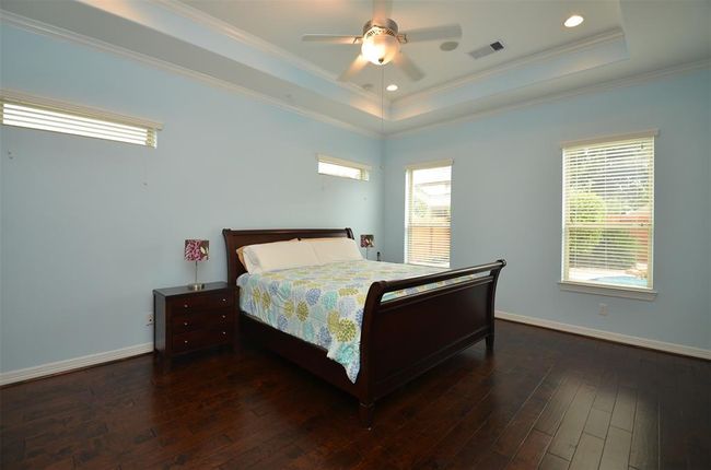 Primary bedroom with view of the pool area. | Image 20