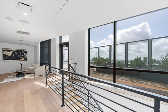 Corridor featuring an upstairs landing, light wood-style floors, recessed lighting, baseboards, and attic access | Image 32