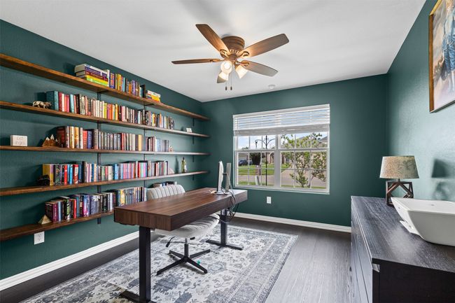 Office featuring ceiling fan, wood finished floors, and baseboards | Image 5