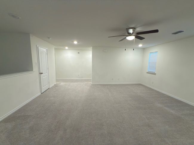 Spare room featuring a ceiling fan, baseboards, carpet, and recessed lighting | Image 33