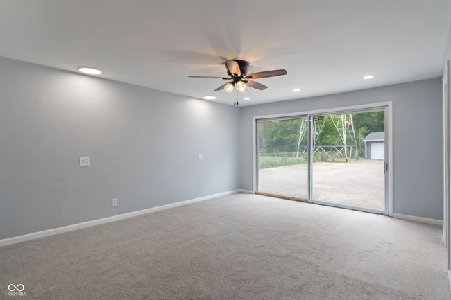 carpeted empty room featuring recessed lighting, a ceiling fan, and baseboards | Image 17