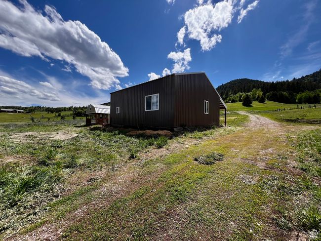 View of side of home with a forest view and a rural view | Image 32