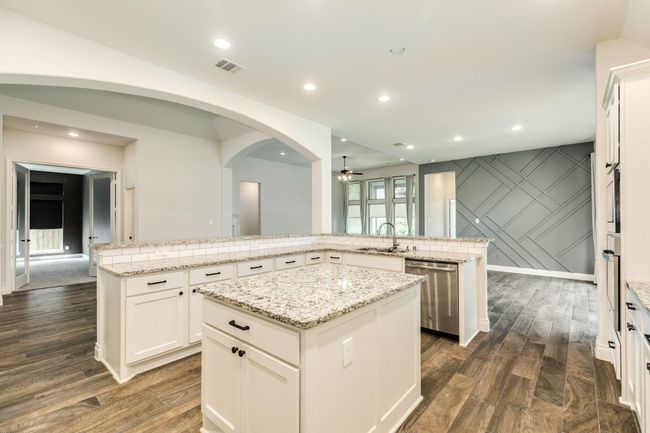From this view, you can see that the media room, family room, and dining room are seamlessly blending together. | Image 18