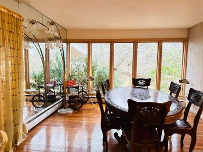 Dining room with a relaxing view | Image 3