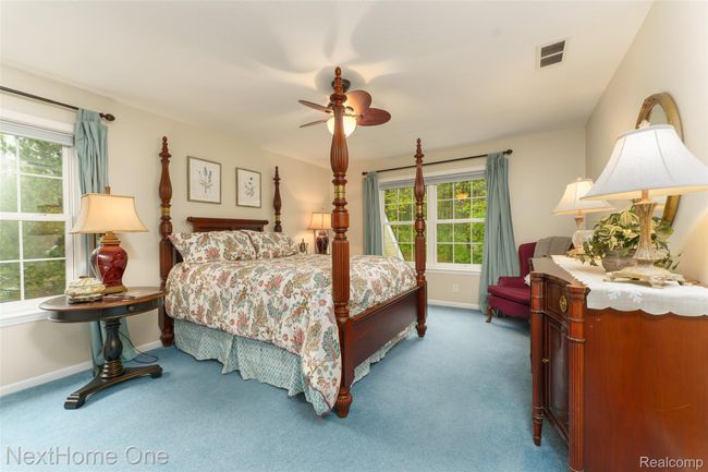Spacious bedroom with backyard view | Image 16