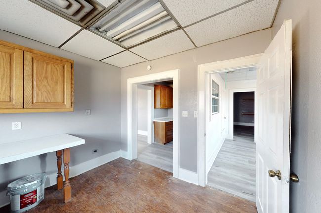 Unfurnished office with a drop ceiling | Image 25