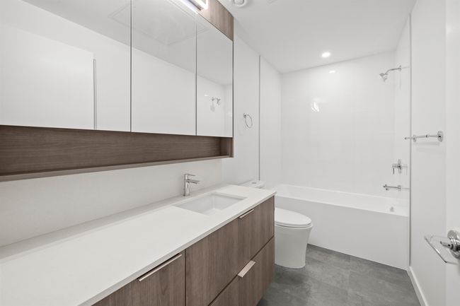 Bathroom featuring vanity, tub / shower combination, and recessed lighting | Image 17
