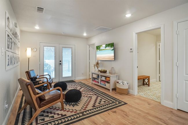 Living area featuring light hardwood / wood-style floors and french doors | Image 13