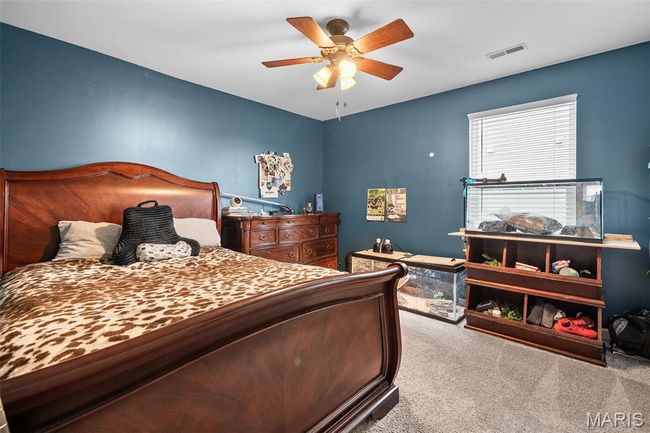 Bedroom with carpet and ceiling fan | Image 35