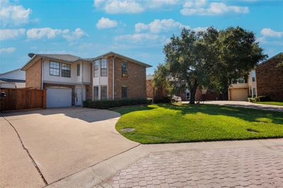 View of front of house with a front yard and a garage | Image 2